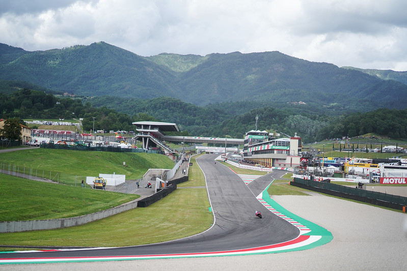 The front straight at Mugello, looking toward Turn 1, with the hills on the background